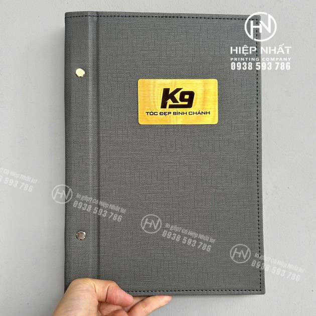 Bìa ngoài menu gáy ốc salon tóc K9